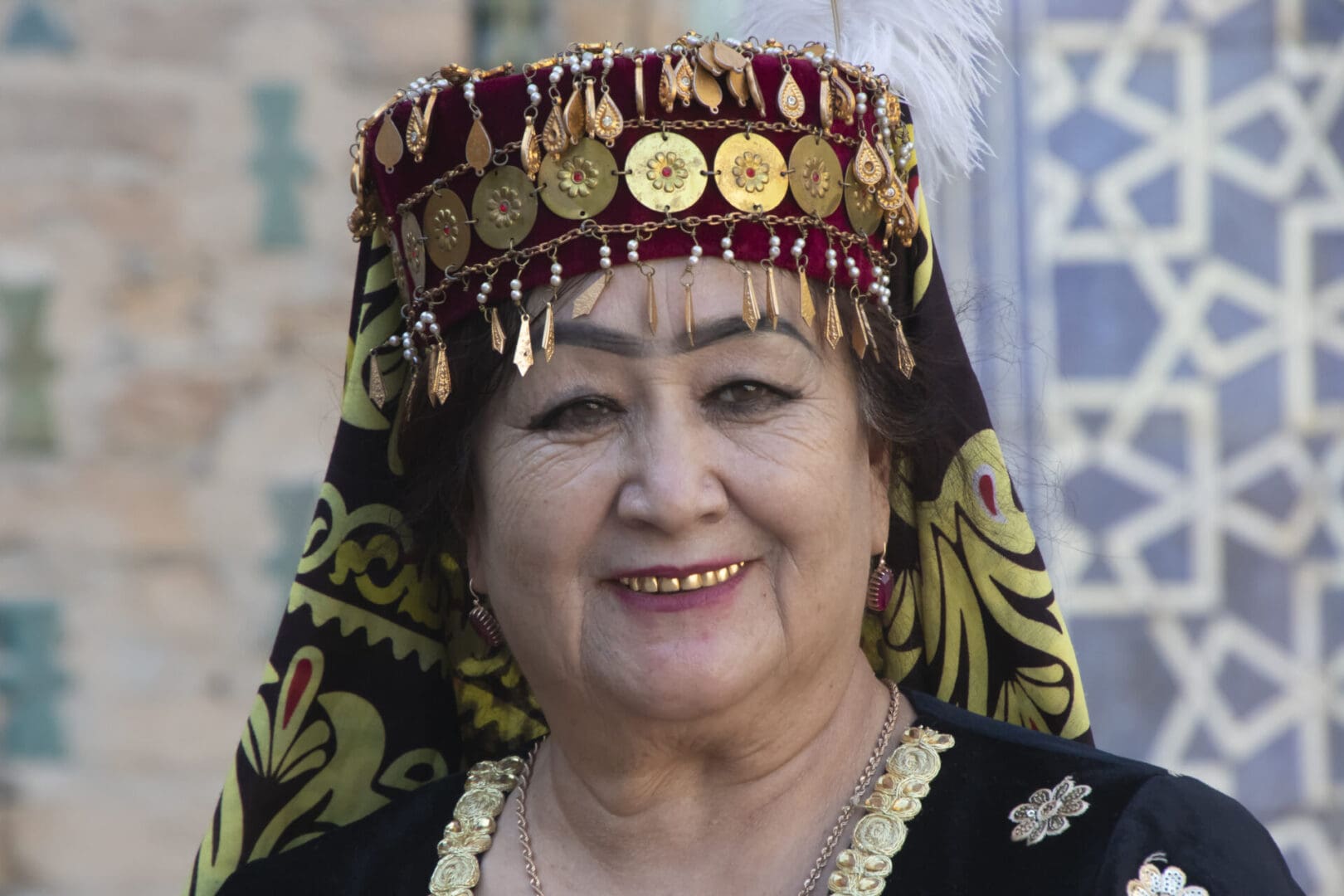 A woman in a traditional costume smiles for the camera.
