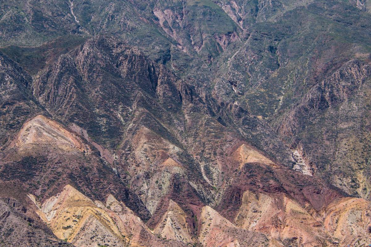 An aerial view of a colorful mountain range.
