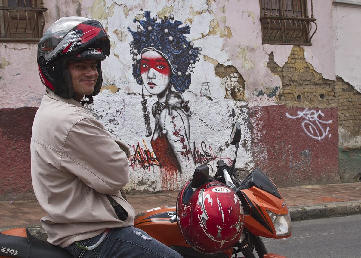 A man wearing a helmet on a motorcycle.