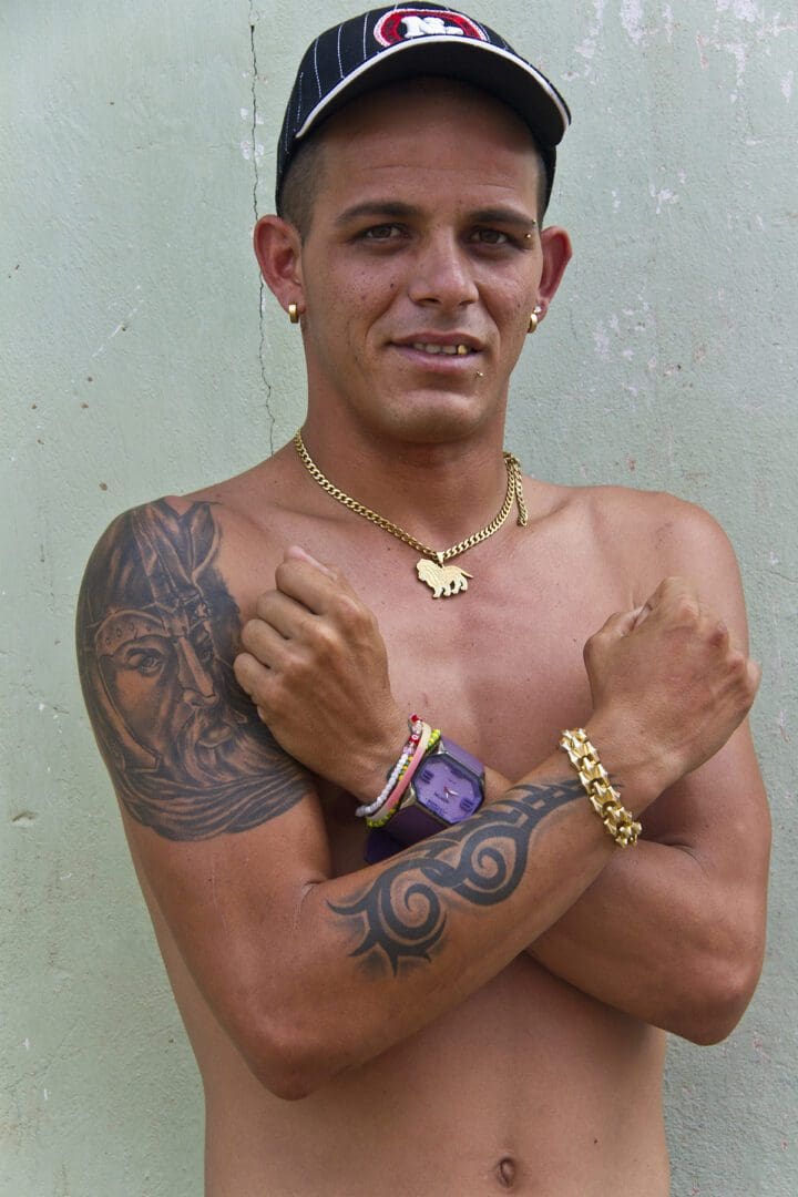 A man with a tattoo on his arm.