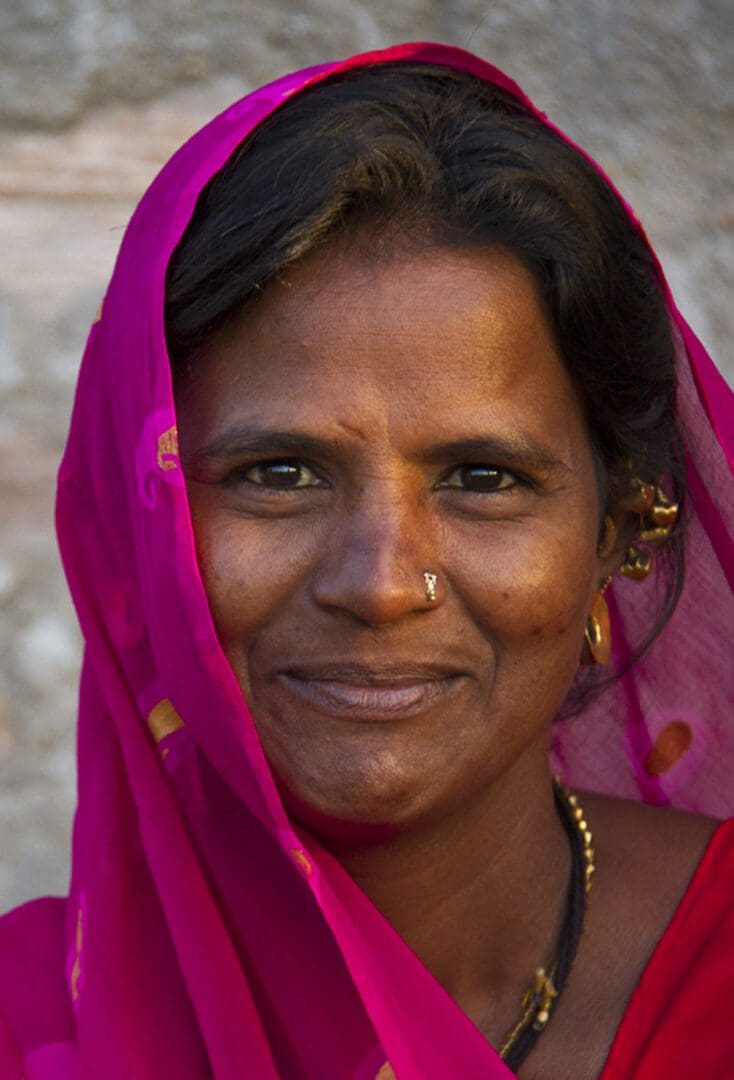 A woman wearing a pink sari.