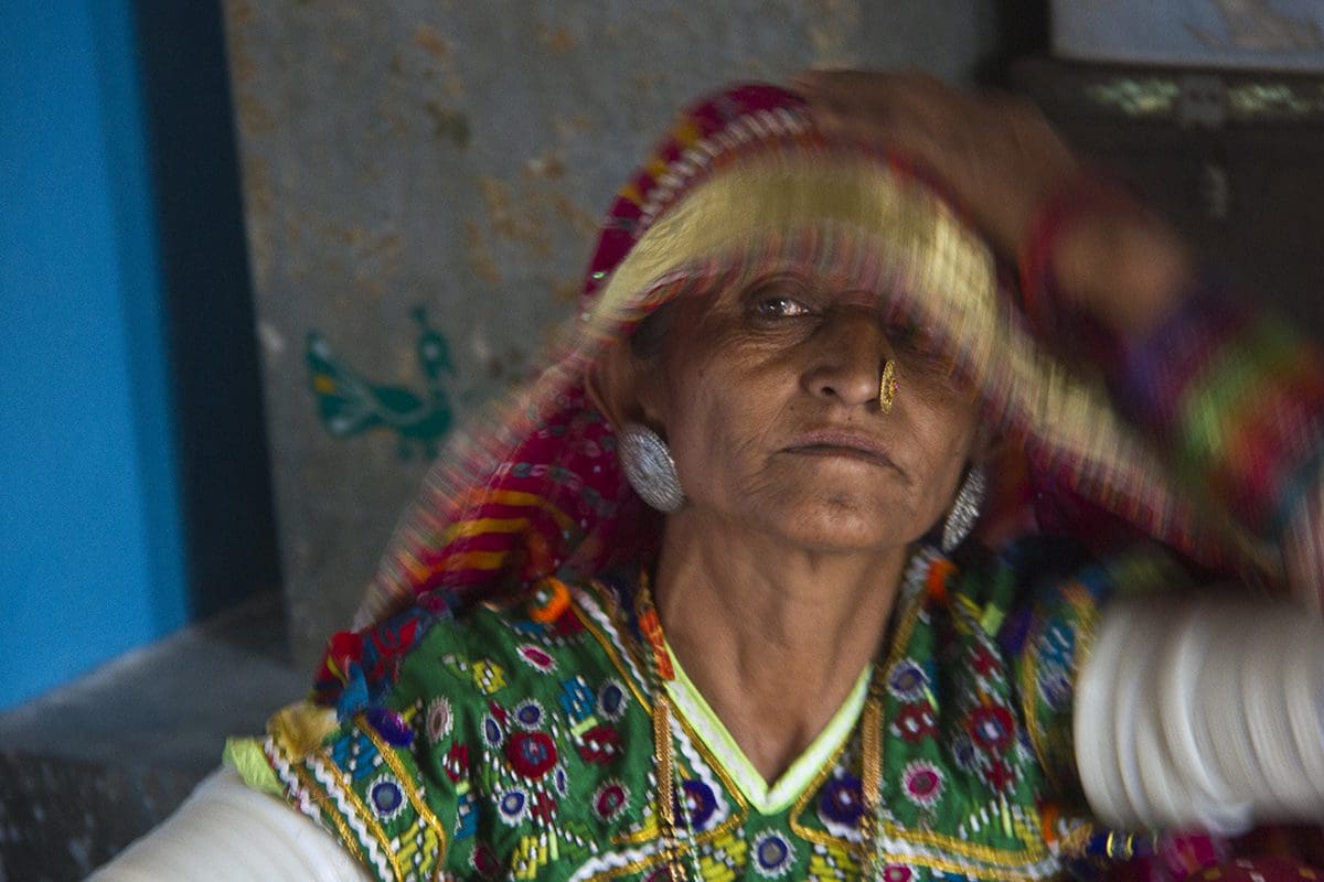 An indian woman wearing a colorful sari.