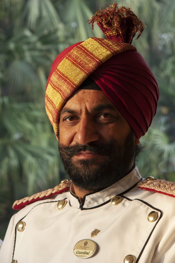 An indian chef in a red turban.