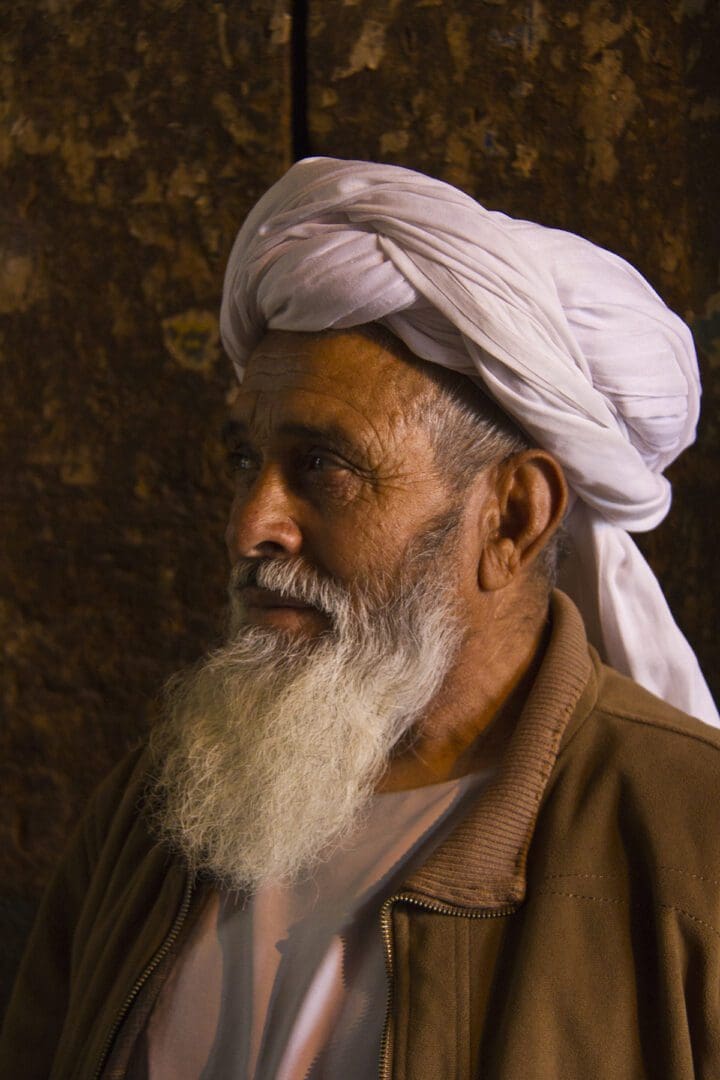 An old man with a white turban.