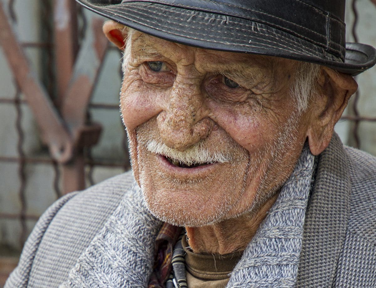 An old man wearing a hat.