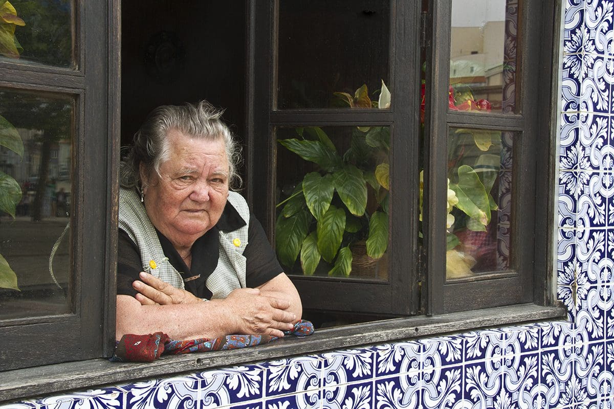A woman looking out of a window.