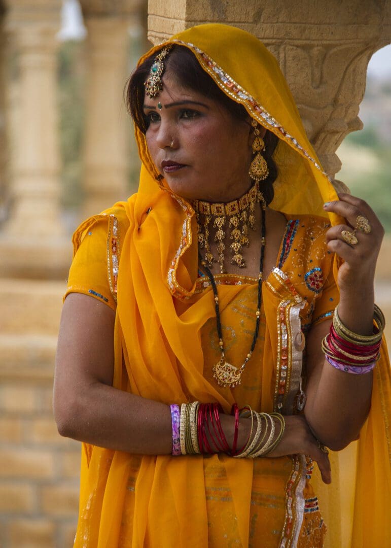 A woman in a yellow sari.