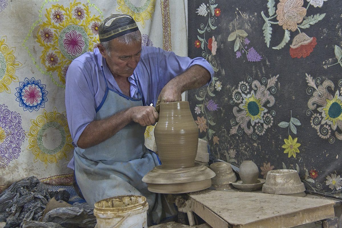 A man working on a pottery wheel.