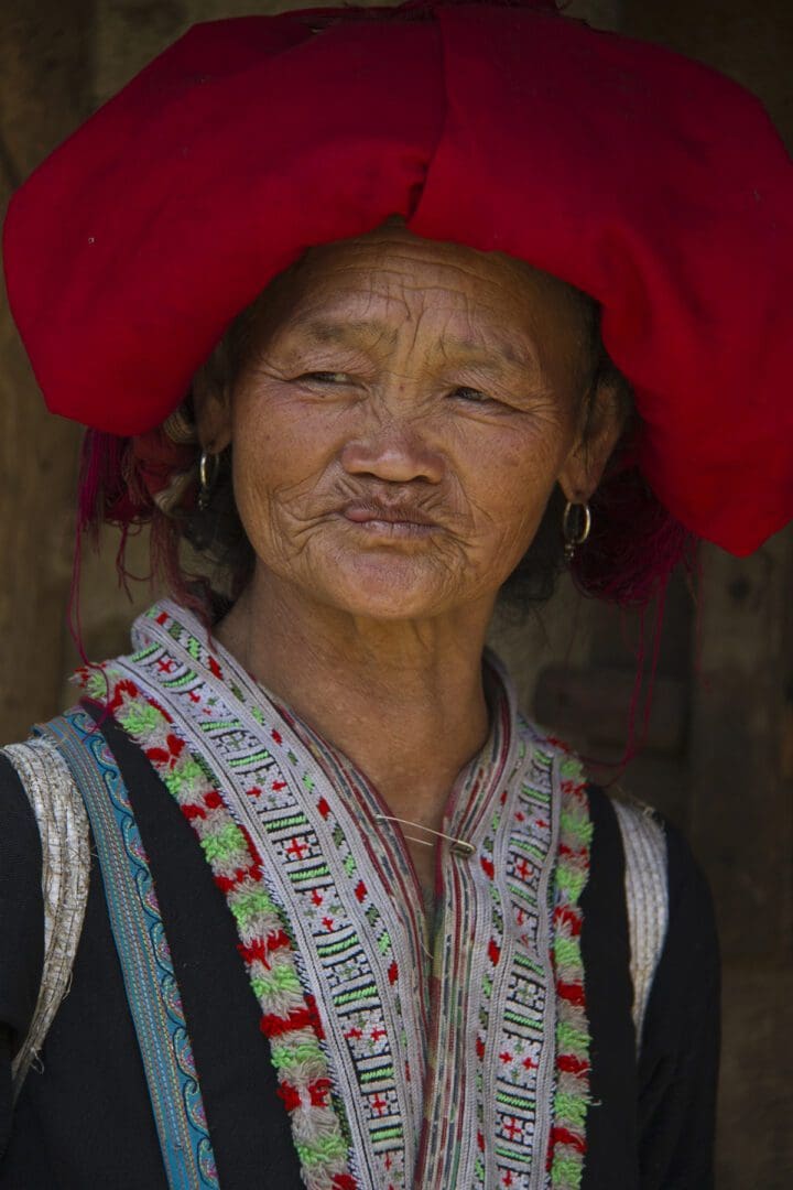A woman wearing a red hat.