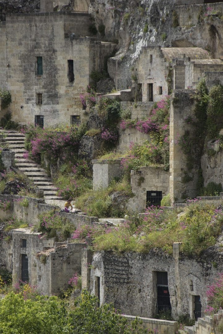 The ruins of a village on the side of a cliff.