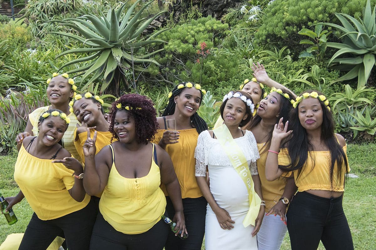 A group of bridesmaids posing for a photo.