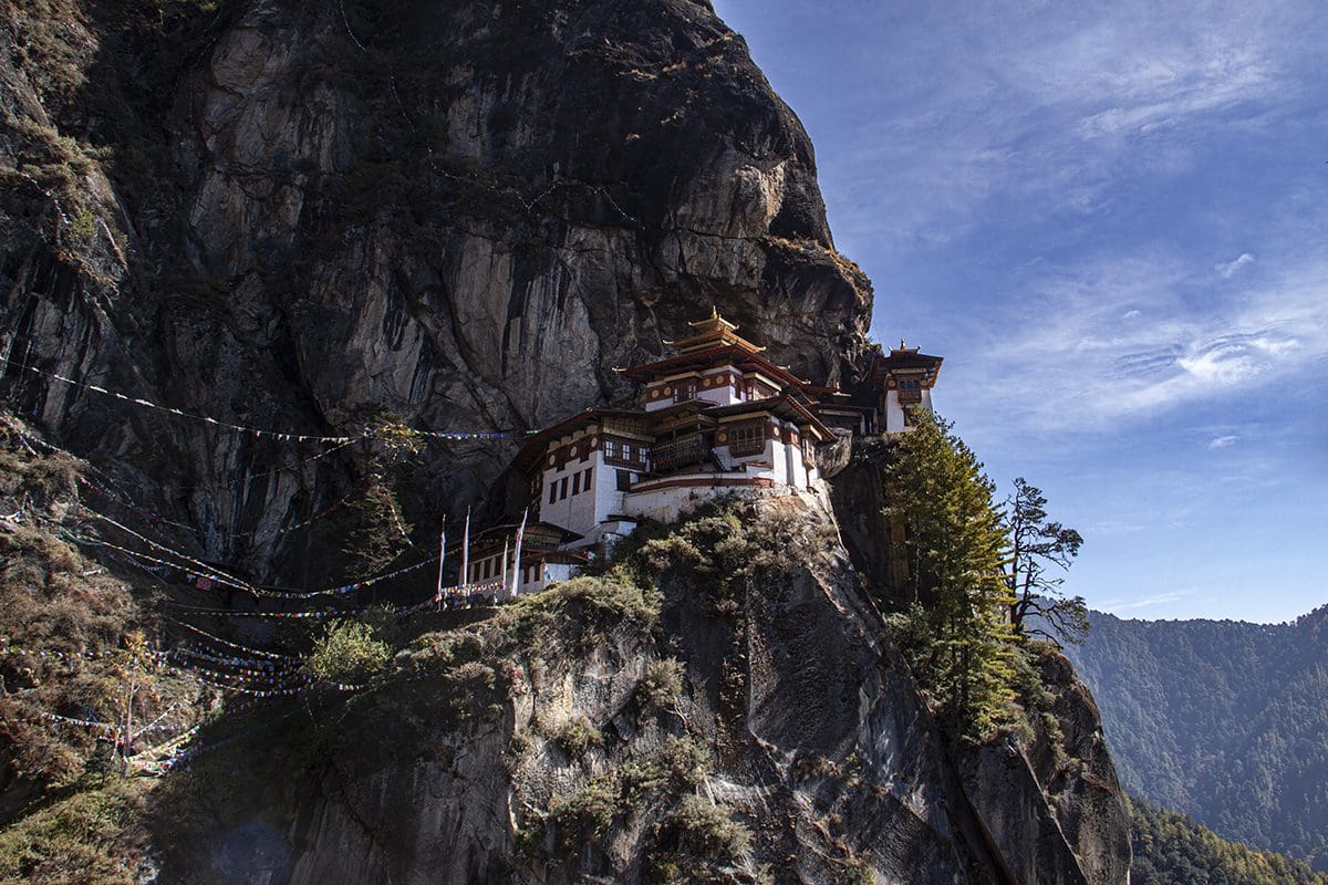 A buddhist temple on the side of a cliff.