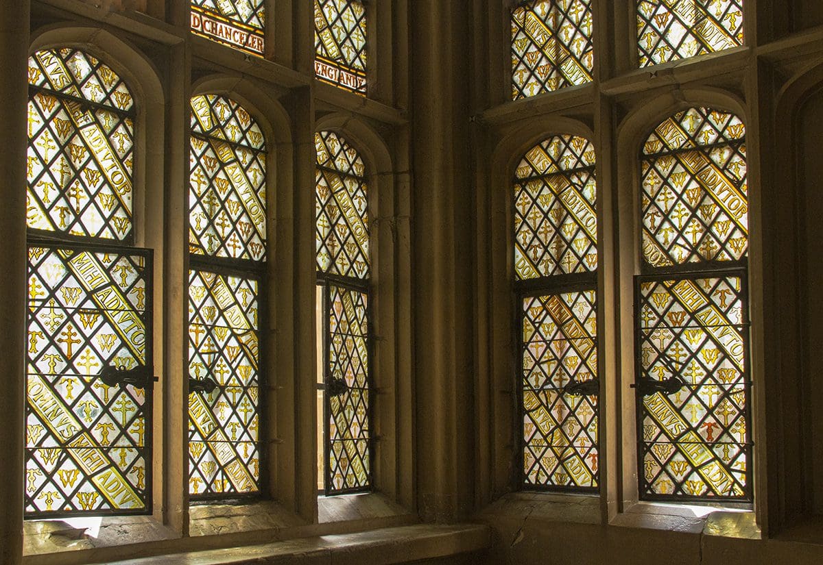 A room with many stained glass windows.