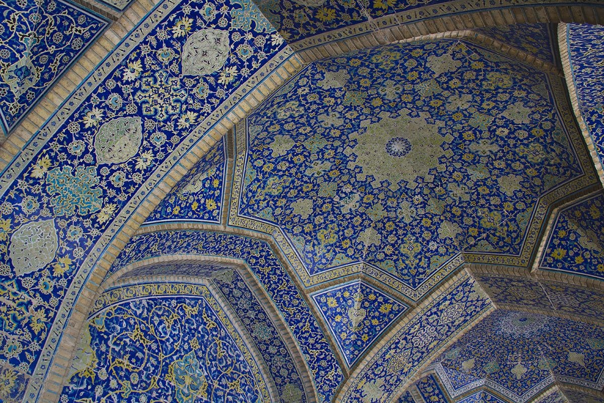 A blue and white tiled ceiling in a mosque.