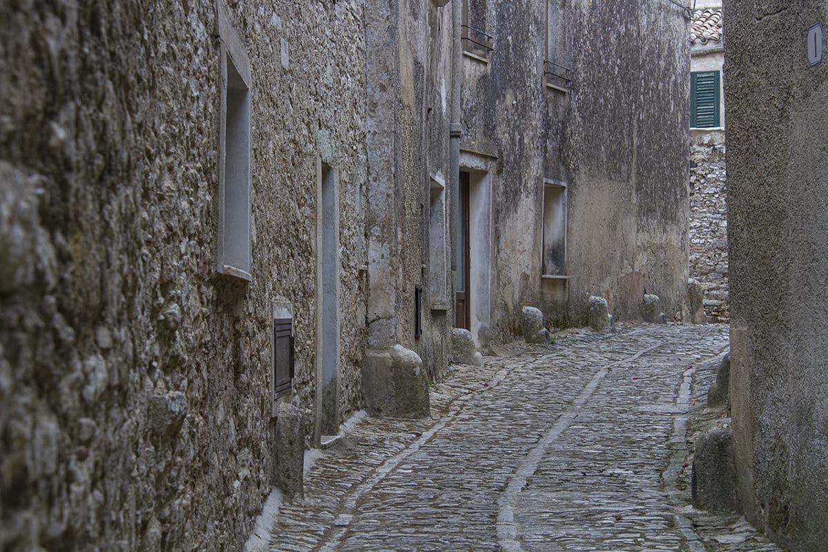 A cobblestone street in a small town.