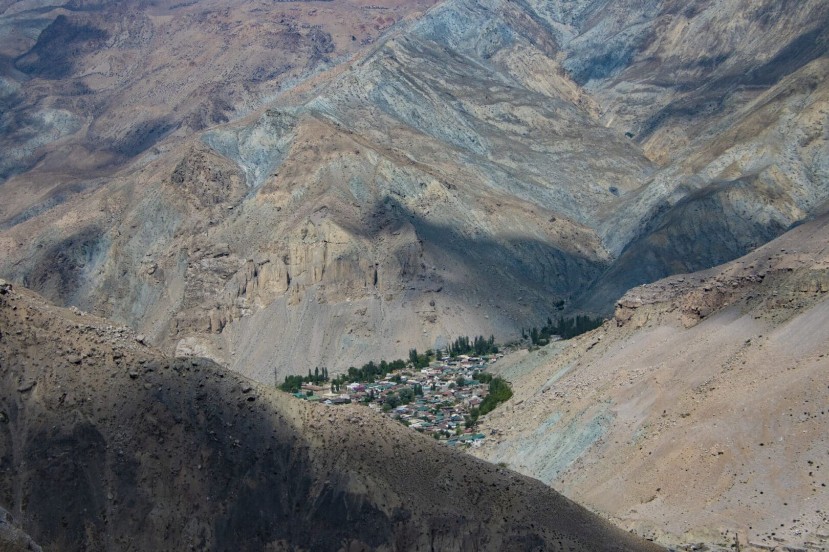 An aerial view of a village in the mountains.