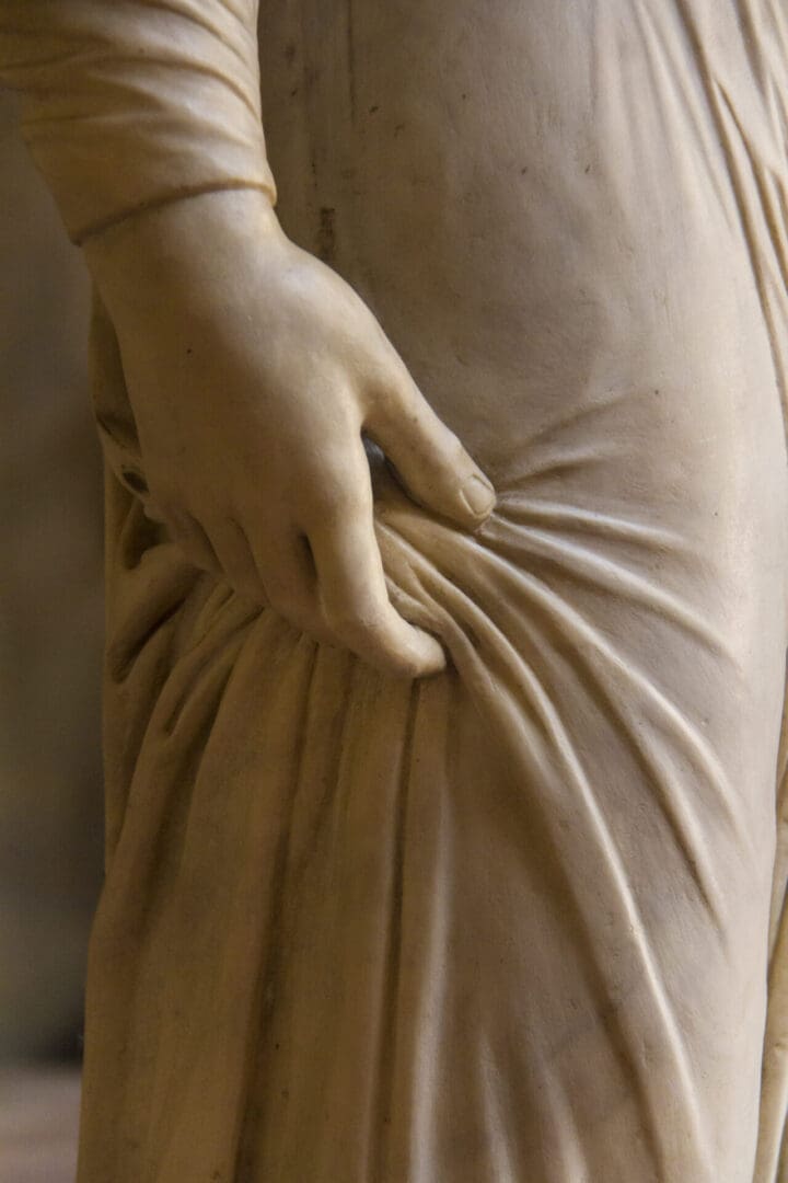 A statue of a woman wearing a dress.